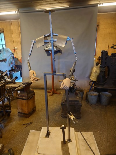 armor stand made of steel pipe and fittings.