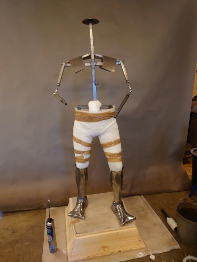 armor stand made of steel pipe and fittings.